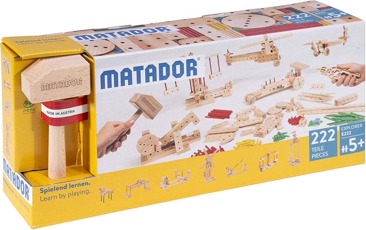 Wooden construction set pieces assembled into a small vehicle model