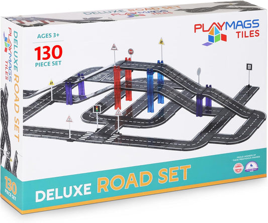 Magnetic tile road layout with curved and straight roads, a bridge and traffic signs