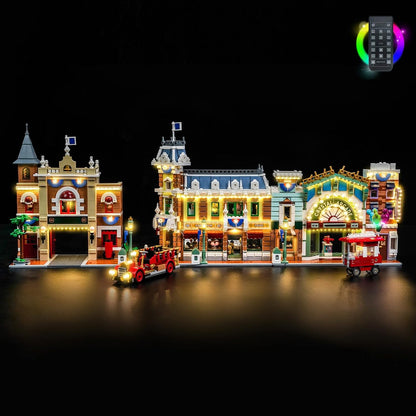 Lit brick-built theme park main street with glowing shopfronts and lamps