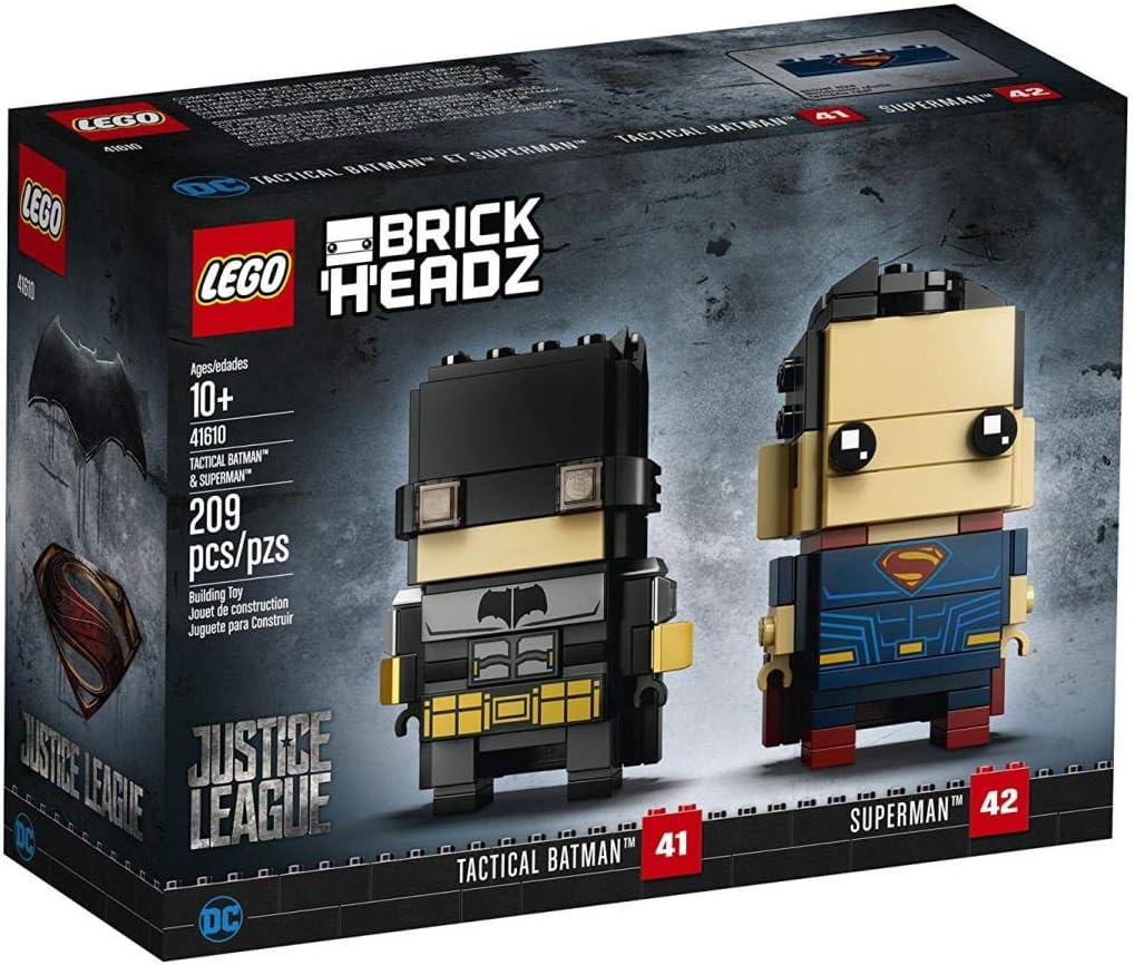 Two square-headed brick superhero figures in tactical suits and capes on stands