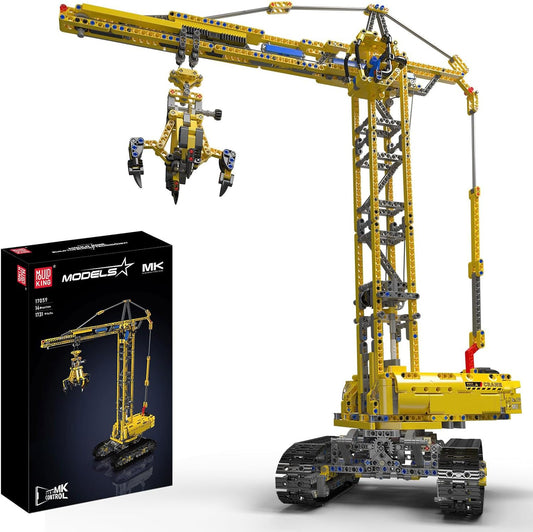 Tall yellow brick tower crane with long jib and hook