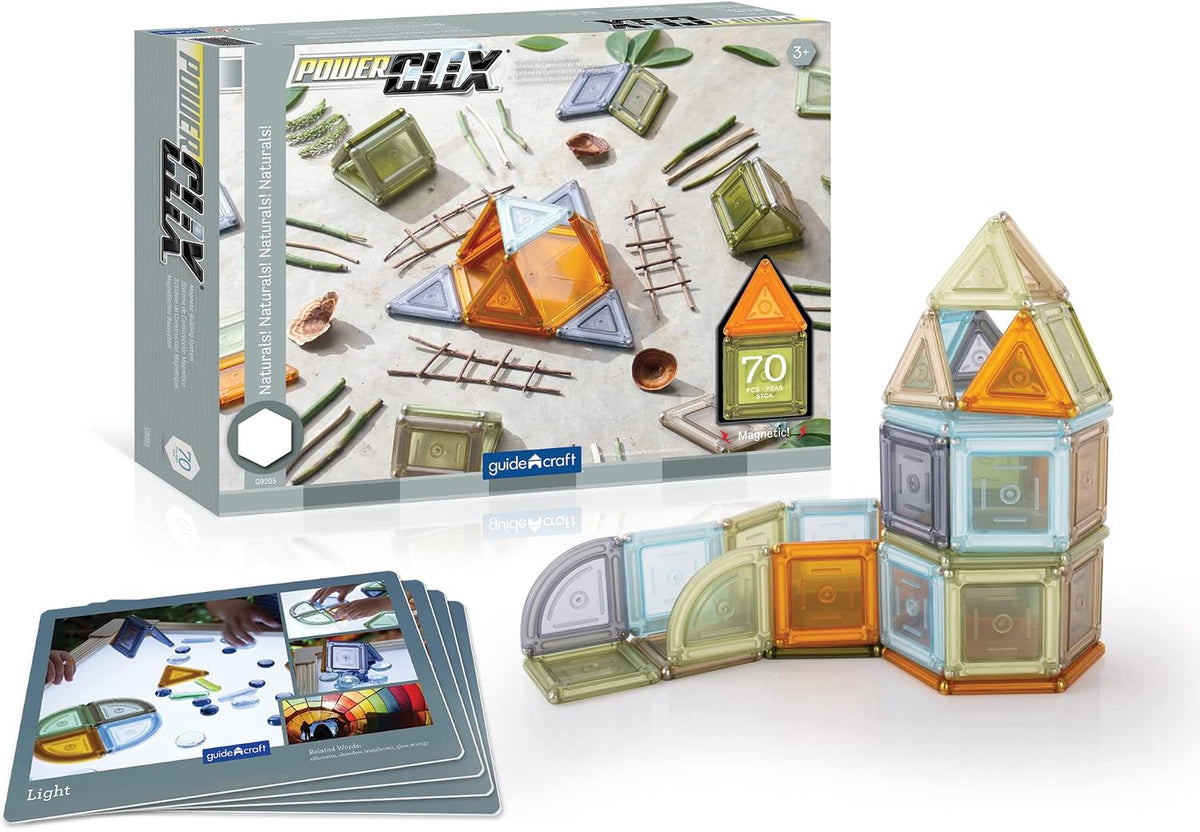 Natural-tone magnetic building solids stacked into shapes beside inspiration cards