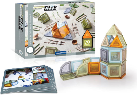 Natural-tone magnetic building solids stacked into shapes beside inspiration cards
