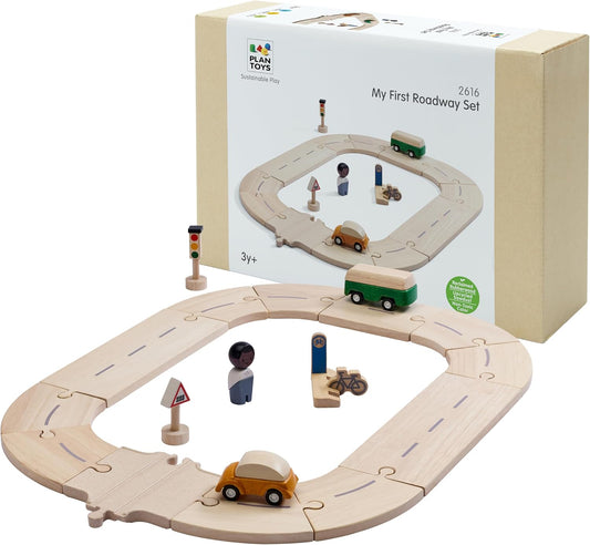 Wooden road track pieces with toy cars, traffic signs and figure