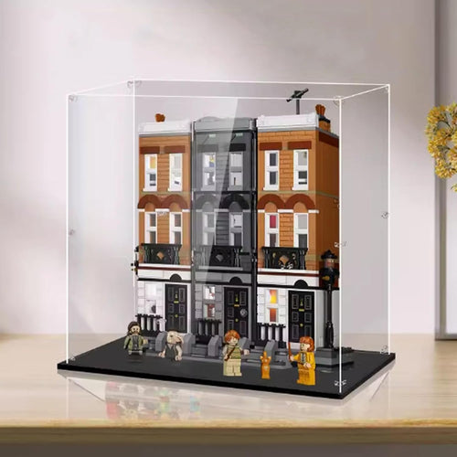 Tall clear acrylic display box around a multi-level plaza brick model
