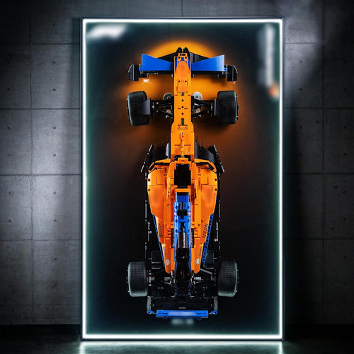 Formula race car brick model on a lit acrylic wall display board