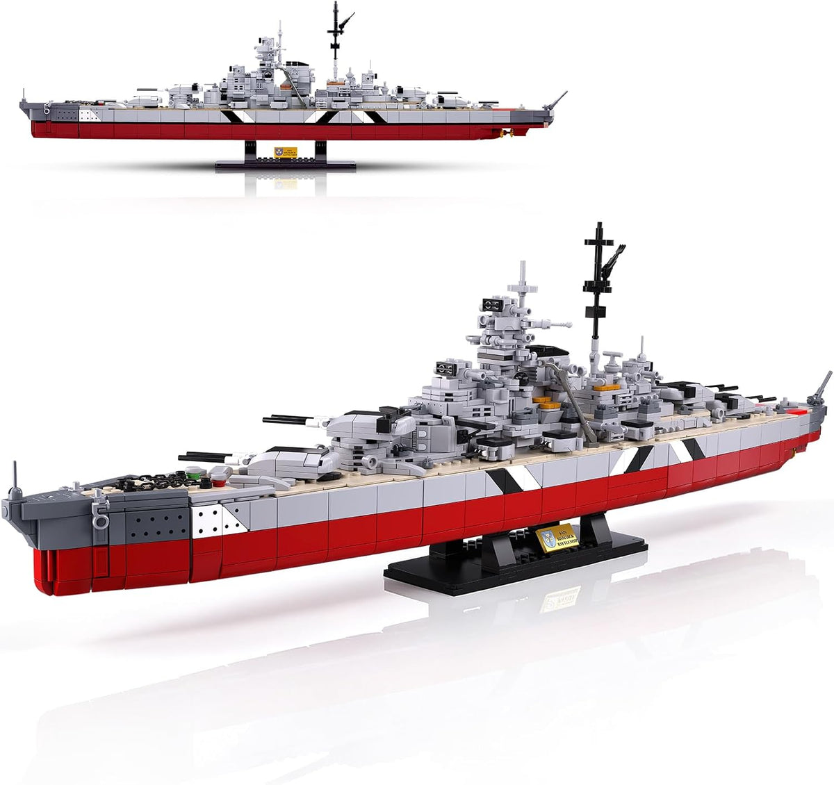 Brick-built WWII battleship model with rotating turrets on a display stand