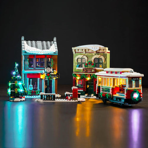 Holiday main street brick model with shop windows and street lamps lit by LED lights