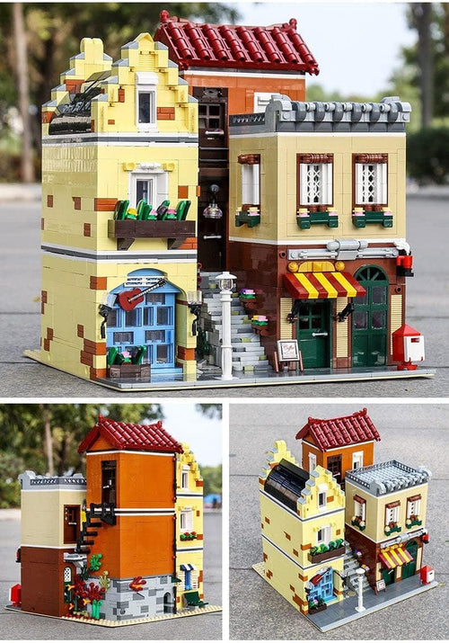 Brick-built corner building with coffee café and music store lit from inside