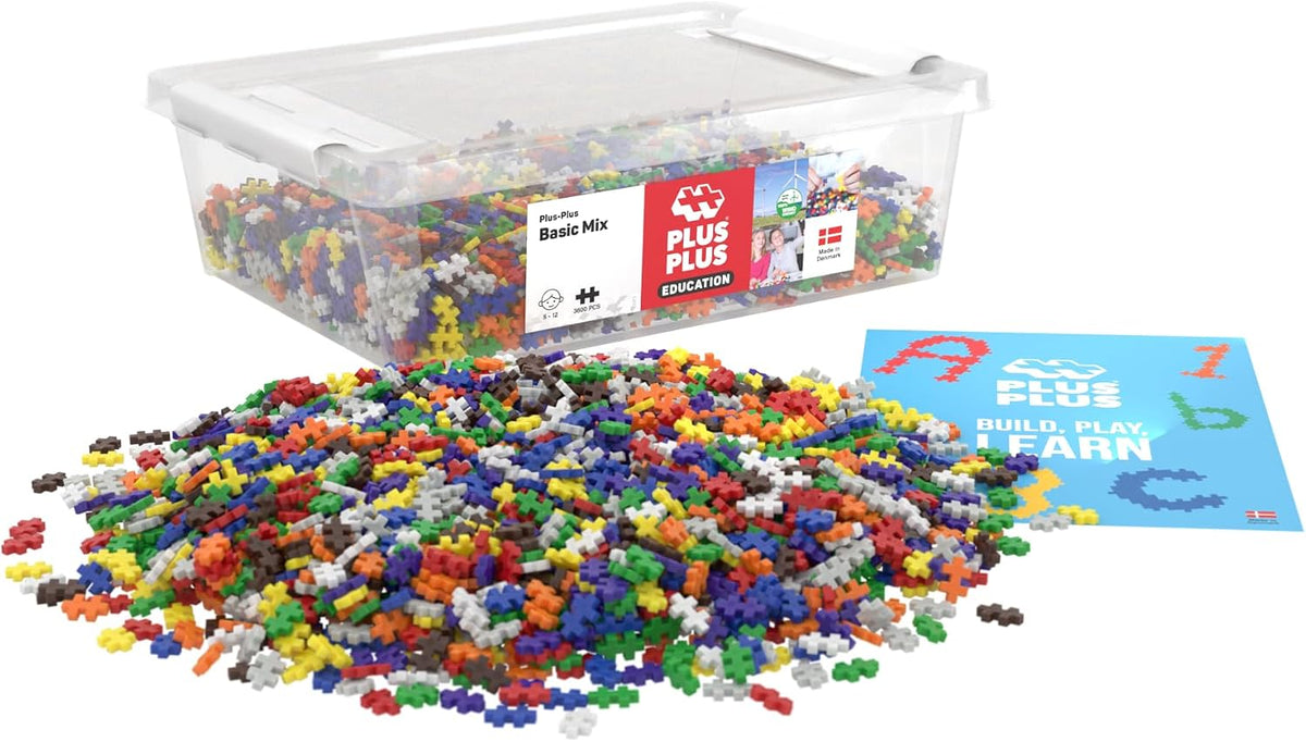 Open tub of small colorful interlocking building pieces with a built mosaic beside it