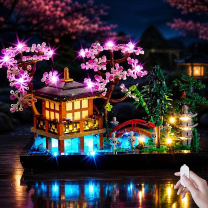 Botanical garden greenhouse brick model glowing with soft LED lights among green plants – view 2