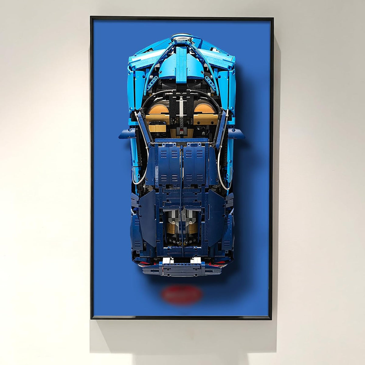 Wall-mounted display frame holding a large technical supercar brick model – view 2