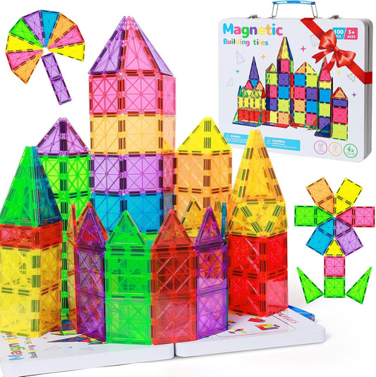 Colorful magnetic tiles built into shapes beside a metal storage case