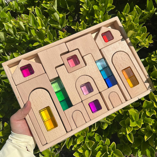 Wooden arch building blocks with colorful acrylic window inserts stacked as a castle