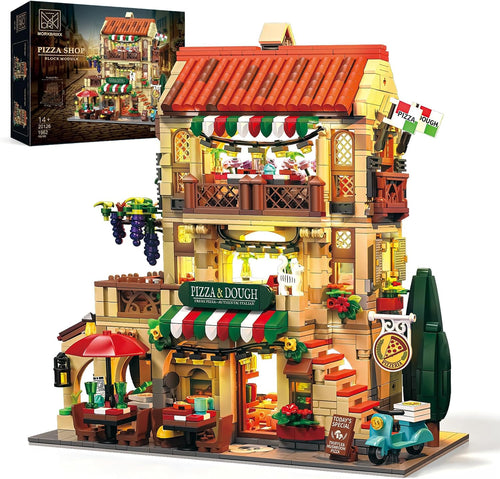 Brick-built illuminated pizza shop restaurant building on a city street