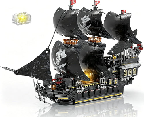 Brick-built pirate ship with sails and glowing LED lights resting on a display stand