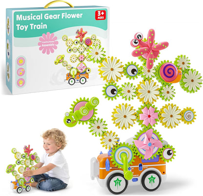 Colorful plastic gear building set forming a flower and a train – view 3