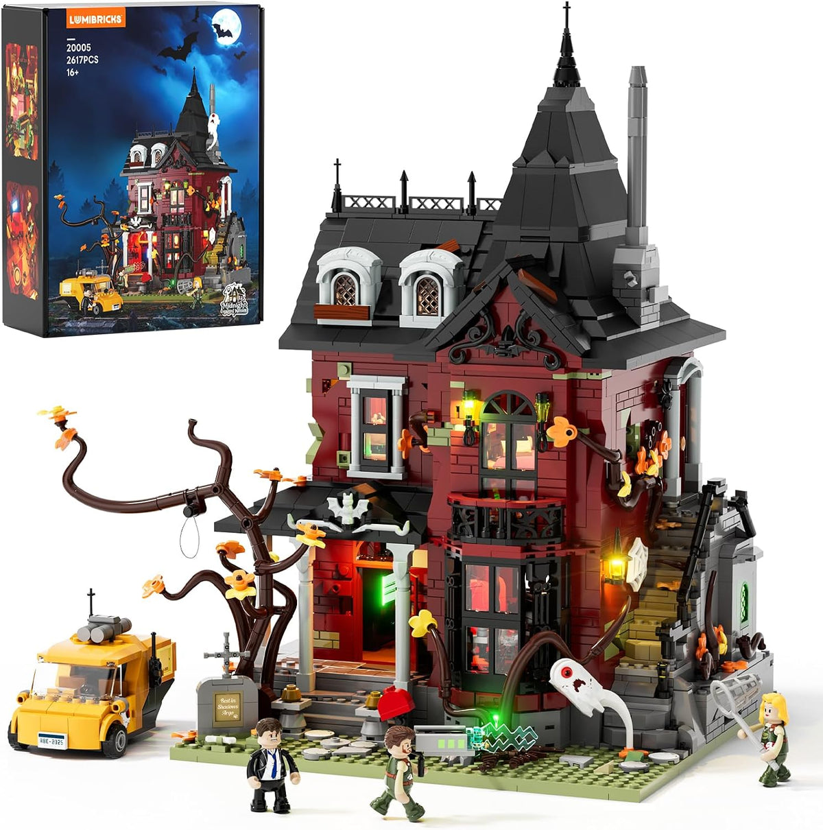 Lit haunted mansion brick model glowing in a dark room
