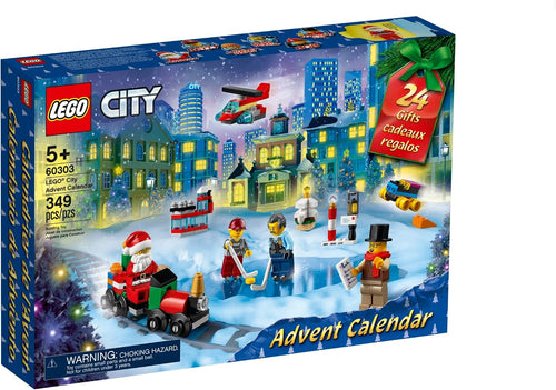 Open holiday advent calendar with mini brick builds on a snowy play mat