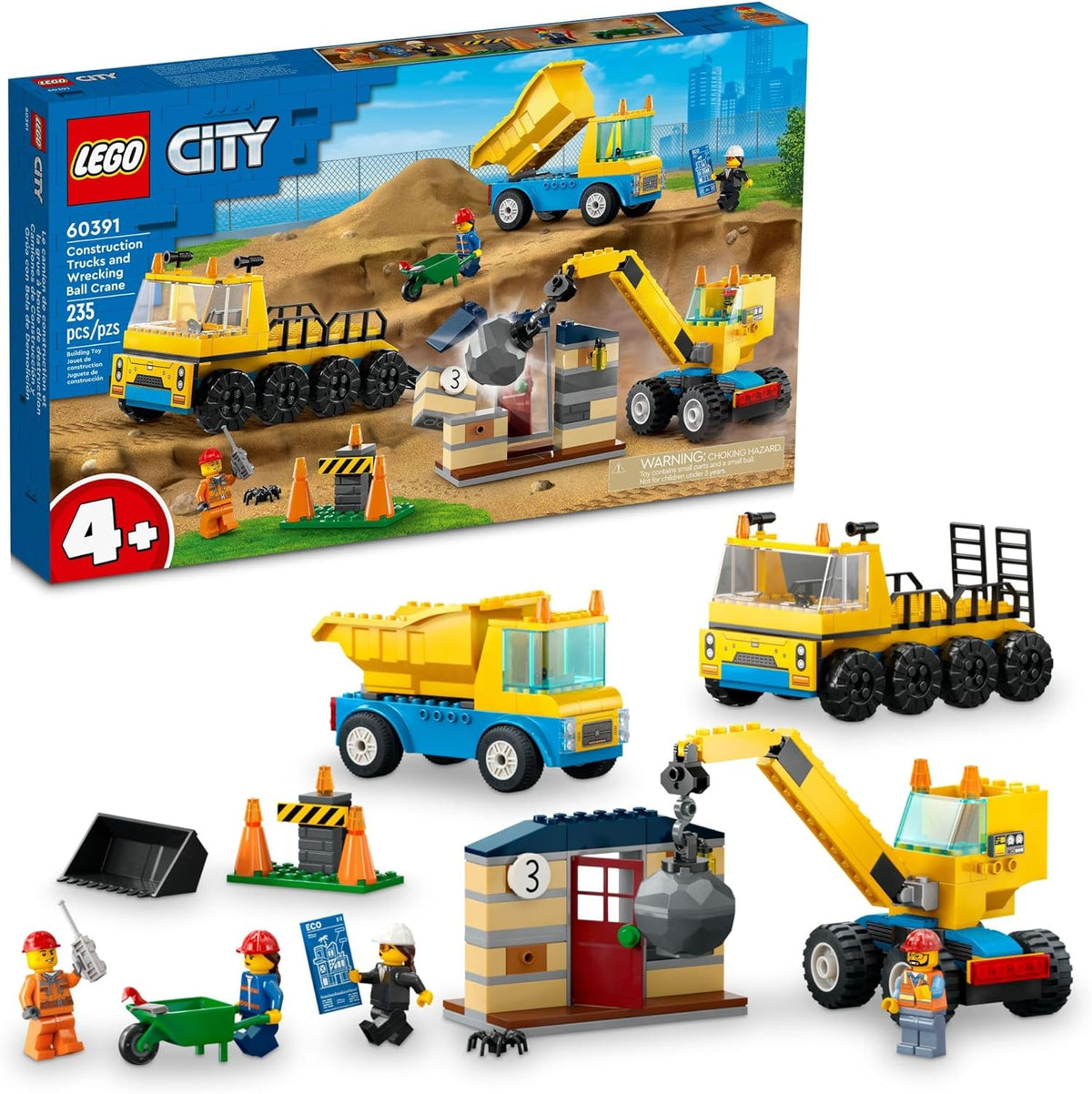 Brick-built yellow wrecking ball crane demolishing a small house beside a dump truck