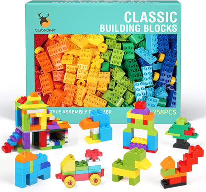 Colorful large building blocks in assorted shapes beside a gift box – view 2