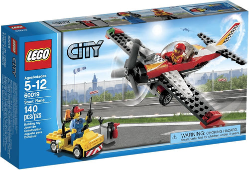 Brick-built stunt plane with propeller next to a small fuel truck and two figures