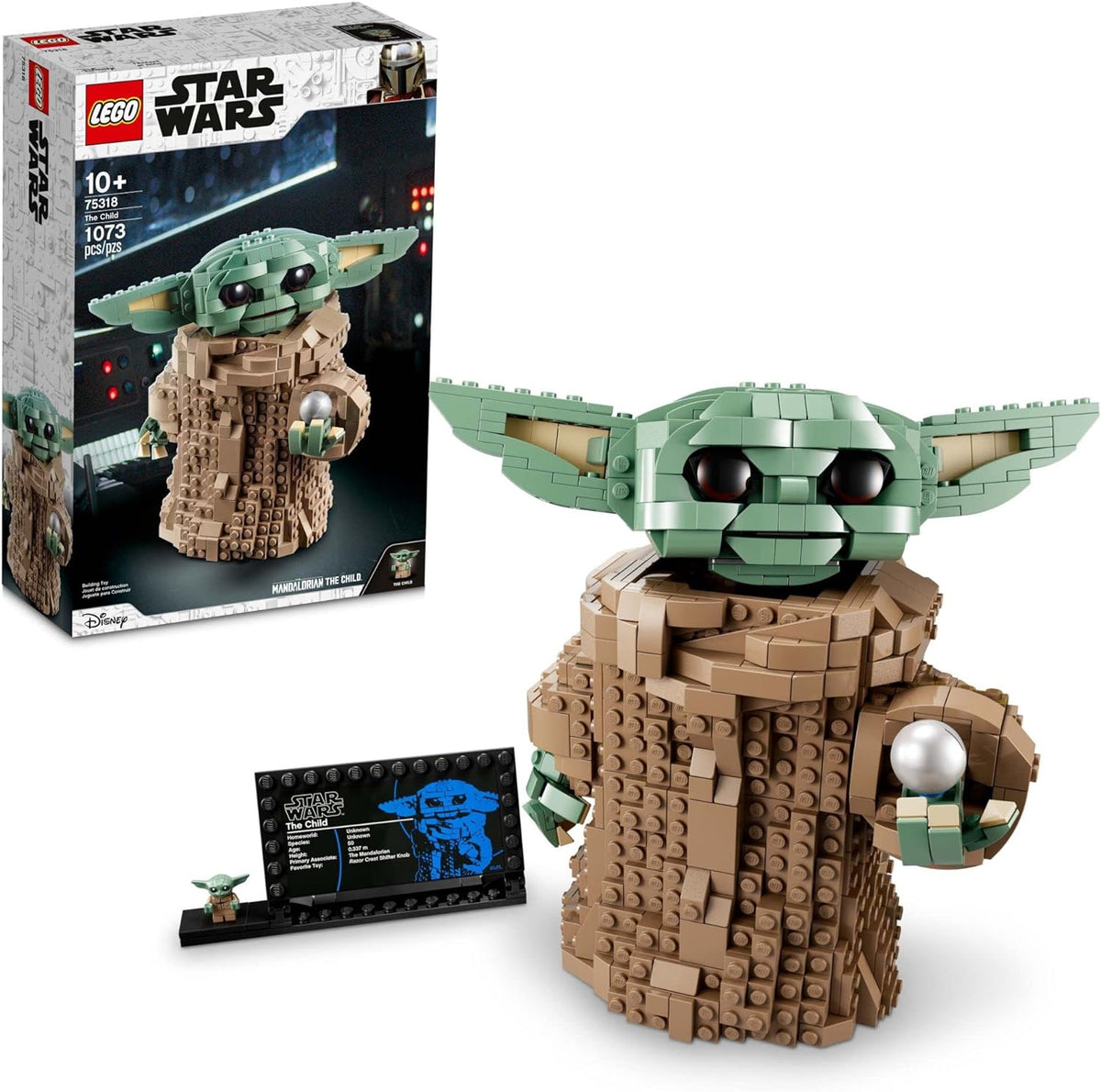 Brick-built big-eared alien baby figure with an information sign