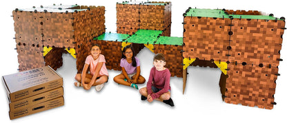 Kids inside a life-size cardboard fort built from pixel-style panels – view 2