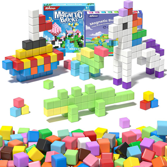 Colorful magnetic building cubes connected into a small tower and shapes