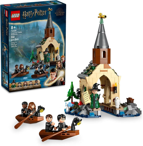 Brick wizard school boathouse with two small lamp-lit boats and figures