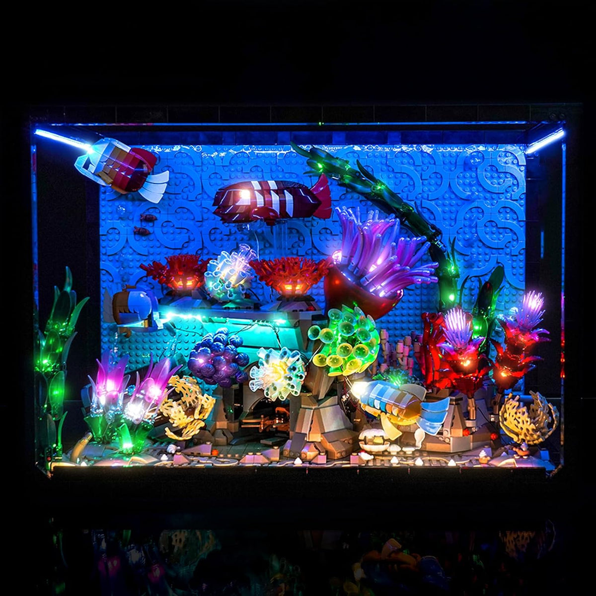 Tropical aquarium brick model with coral and fish lit by LED lights – view 2
