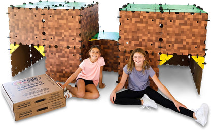 Kids inside a life-size cardboard fort built from pixel-style panels – view 3