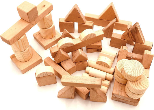 Unfinished natural hardwood building blocks stacked into a small tower
