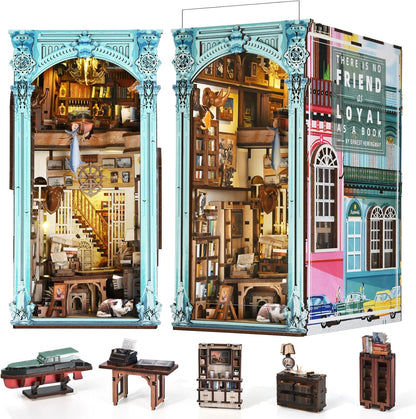 Lit fantasy castle book nook diorama standing between books on a shelf – view 15