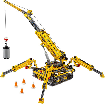 Brick-built crawler crane with extended boom and outriggers