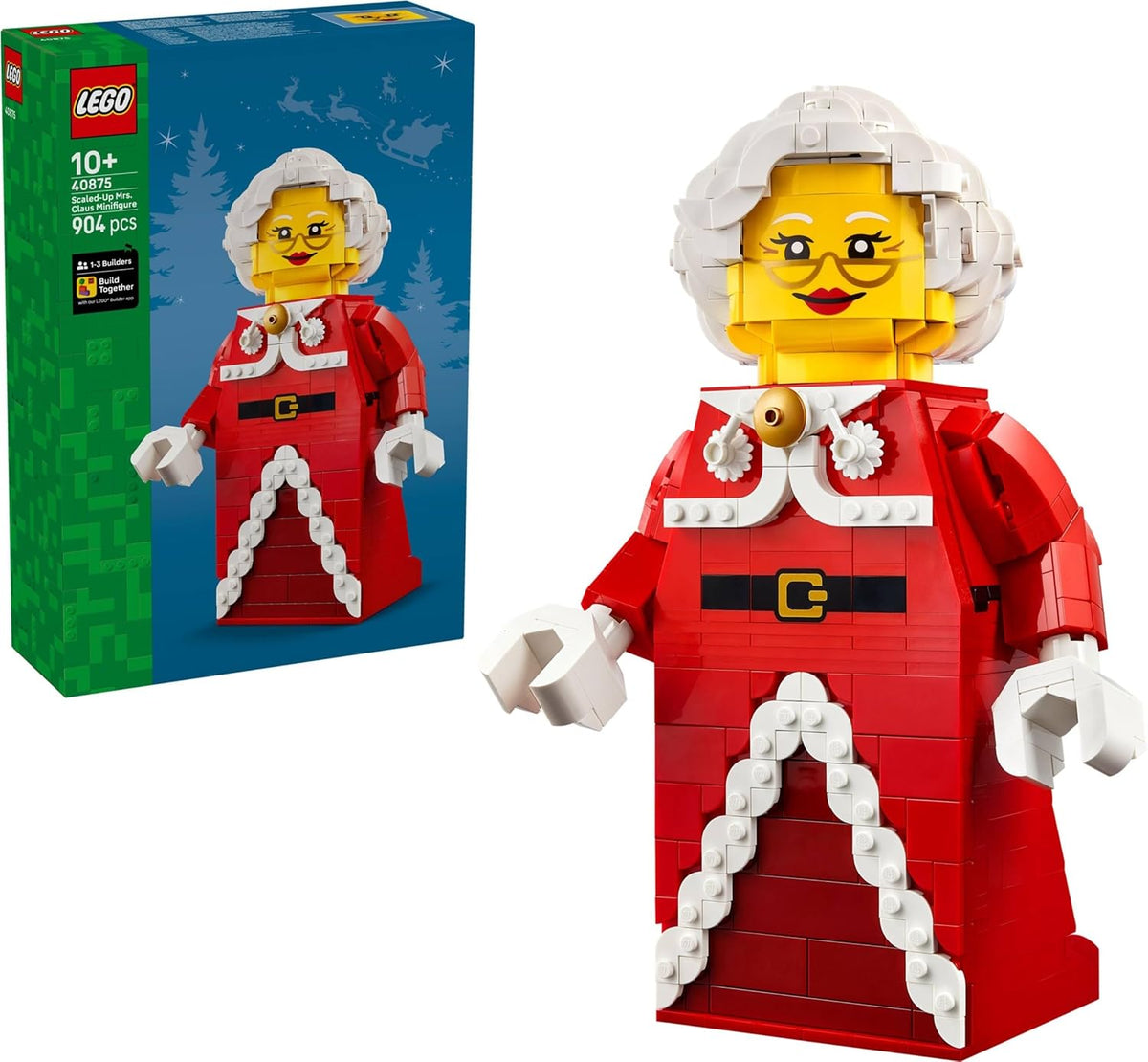 Large brick-built Mrs. Claus figure in a red dress with white hair and a smile