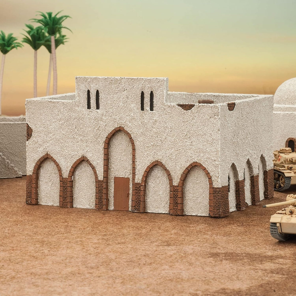 Sand-colored desert buildings arranged as terrain on a tabletop wargaming board