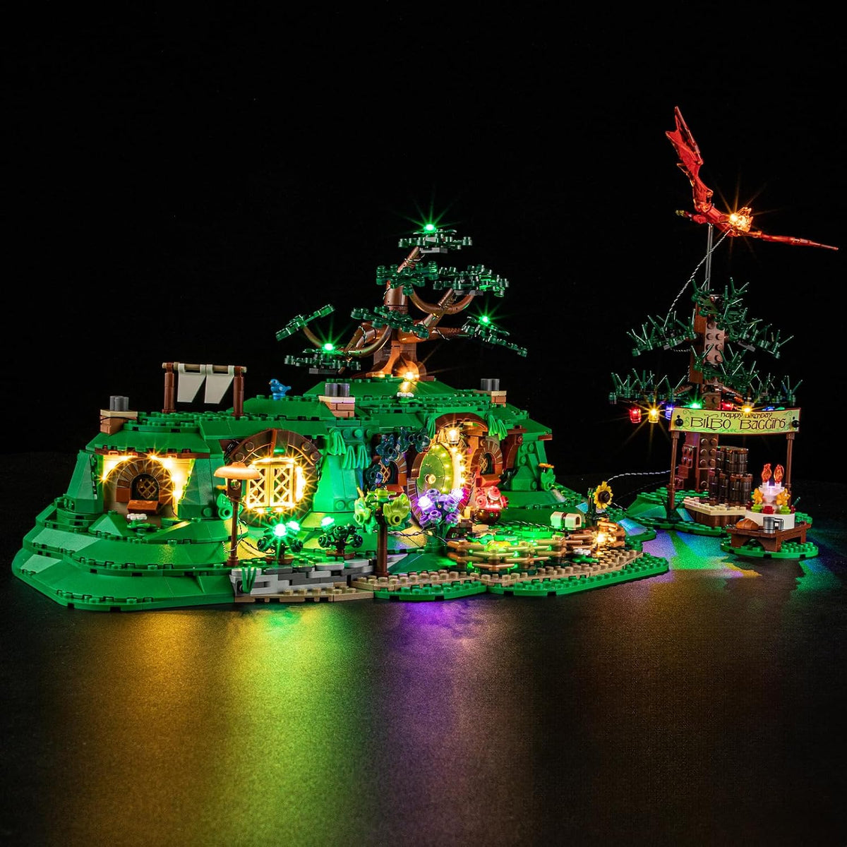 Round-door hillside cottage brick model lit from inside by an LED light kit