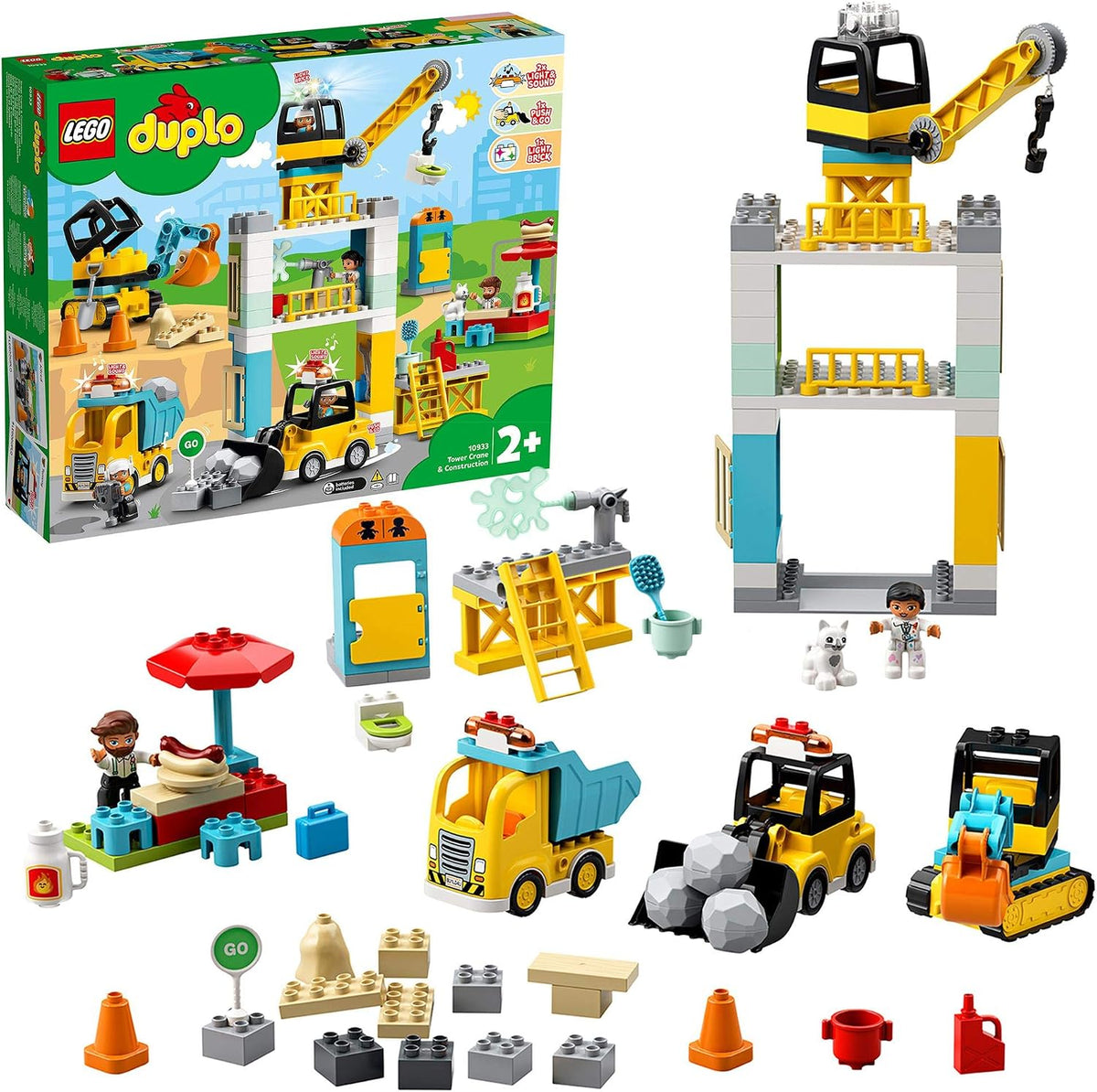 Large-brick construction site with crane, bulldozers and garbage truck