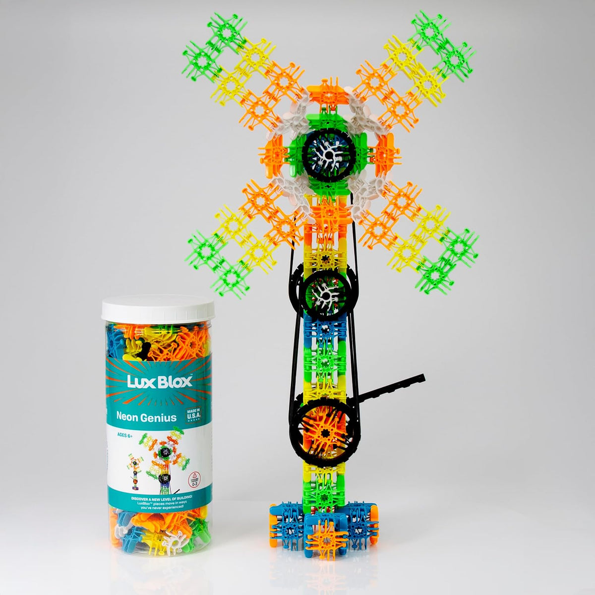 Tall neon-colored hand-crank windmill built from snap-hinge pieces