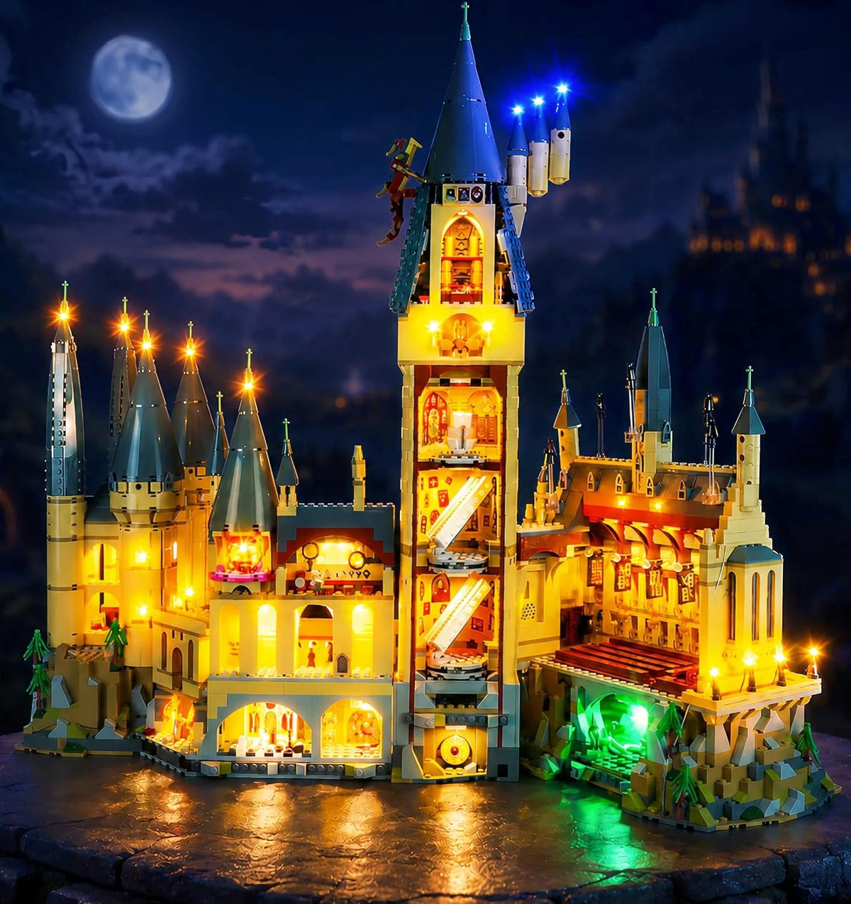 Large wizard castle brick model with towers glowing from warm interior lights