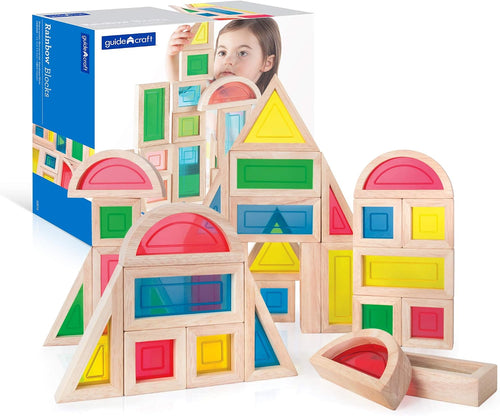 Rainbow colored wooden blocks stacked into a small tower
