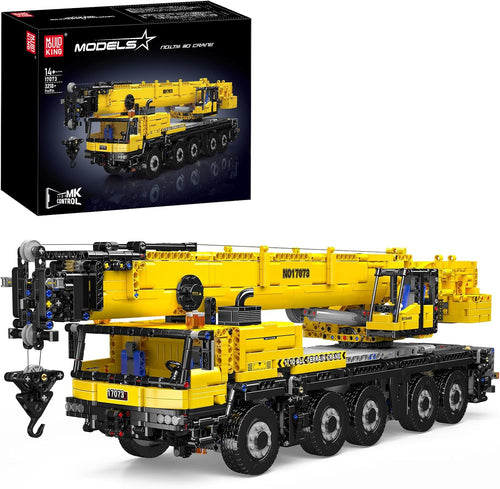 Yellow brick-built mobile crane truck with crane boom raised