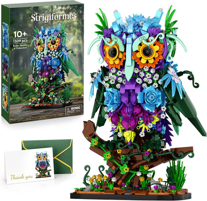 Brick-built owl decorated with colorful flowers and leaves perched on a round base