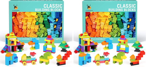 Colorful large building blocks in assorted shapes beside a gift box