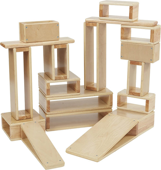 Eighteen natural hollow wooden building blocks stacked into a low wall