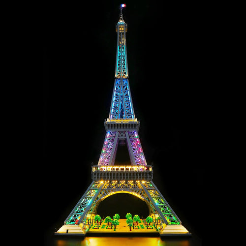 Tall Eiffel Tower brick model lit with warm golden LED lights at night