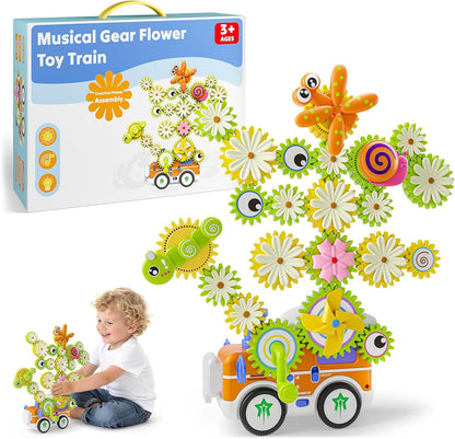 Colorful plastic gear building set forming a flower and a train – view 4