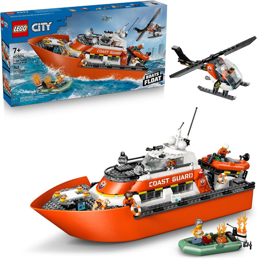 Brick-built red and white coast guard patrol boat with helicopter on its landing pad