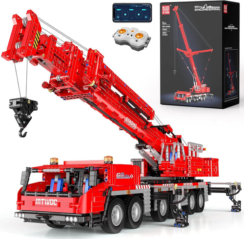 Large brick-built yellow mobile crane with extended arm and stabilizer legs